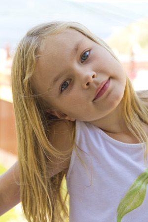 Portrait of cute girl with blond hairの写真素材
