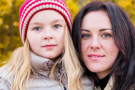 Photo of mother and daughter in autumnの写真素材