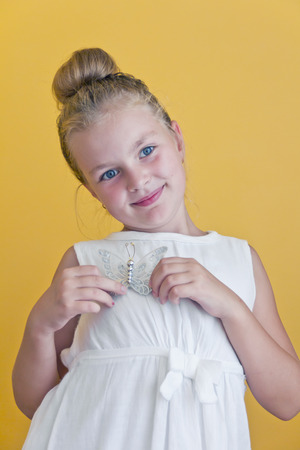 Cute girl with blond long hair and blue eyesの写真素材