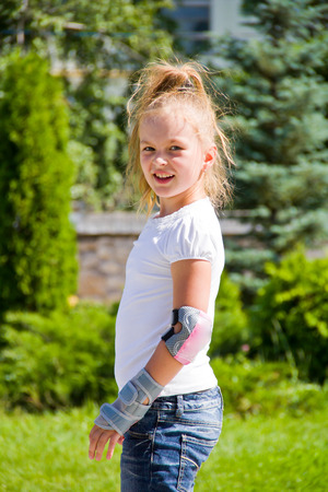 Photo of cute girl on roller skates in summerの写真素材