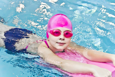 Photo of cute girl in swimming poolの写真素材