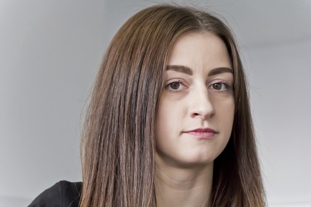 Horizontal portrait of beautiful brunette with long hairの写真素材