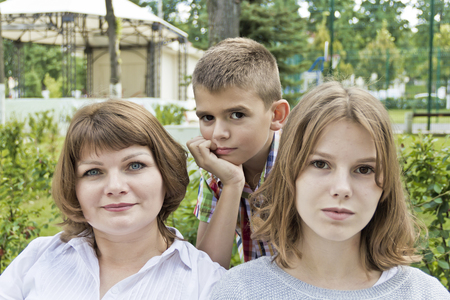 Happiest mother with daughter and son in summer timeの写真素材