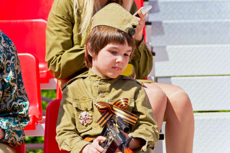 SAMARA, RUSSIA - MAY 9, 2016: Boy in soldier costume at the honor of annual Victory Day, May, 9, 2016 in Samara, Russiaのeditorial素材