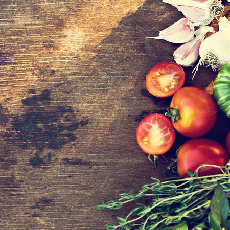 Tomatoes, garlic and spicy herbs.の写真素材