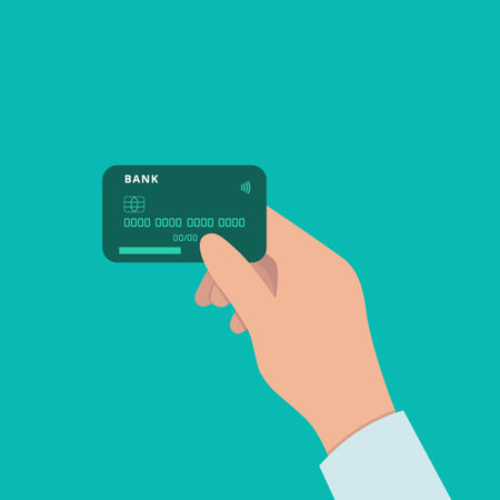 A hand holding a credit card. Payment by bank card. A person with a bank card. The concept financial transactions, online shopping. Vector illustration in a flat style isolated on a blue backgroundのイラスト素材