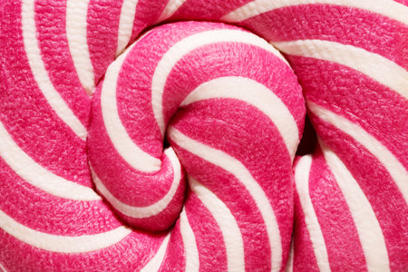 Swirly red and white Lollipop candy abstract background. Close-up.の写真素材