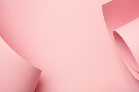 Pastel pink curved paper abstract background. Creative frame, minimal, copy space.の写真素材