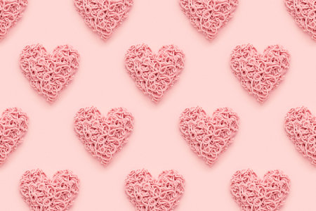 Hearts pattern for Valentines Day on pink background. Abstract, flat lay.
