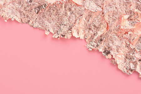 Rose gold paper torn edge frame, pink abstract background, copy space.の写真素材