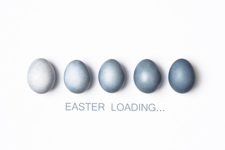 Dyed blue gradient Easter eggs row, Easter loading concept.