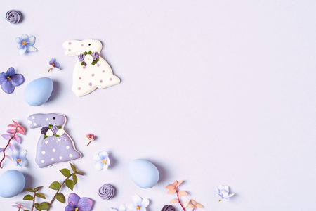 Easter background with Easter decorations frame on violet copy space.