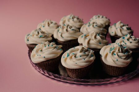 Tasty cupcakes on a pink background. Birthday cupcakes. Candy bar. Wedding. Partyの写真素材