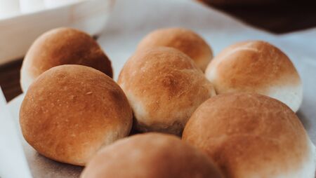 Bakery concept. Fresh home-made bread on the table.の写真素材