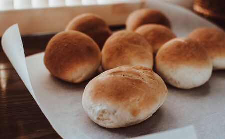 Bakery concept. Fresh home-made bread on the table.の写真素材