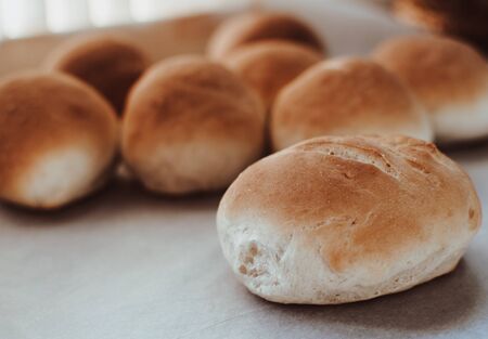 Bakery concept. Fresh home-made bread on the table.の写真素材
