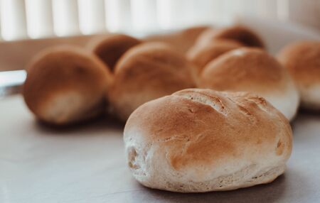Bakery concept. Fresh home-made bread on the table.の写真素材