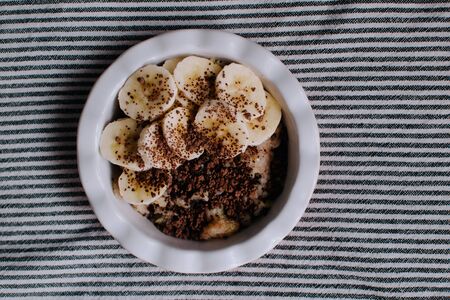 Breakfast in bed. Board with tasty breakfast on the bed.の写真素材