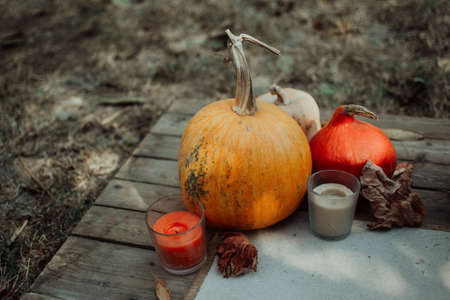 Orange Halloween pumpkins on a wooden background, holiday decoration. Halloween mood.の写真素材
