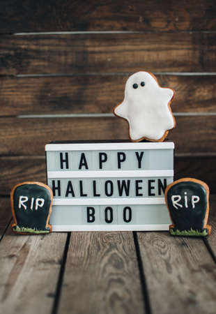 Halloween cookies for holiday. Pumpkins. Autumn mood. Happy Halloween concept. White light box on the wooden table.の写真素材