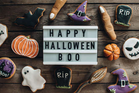 Halloween cookies for holiday. Pumpkins. Autumn mood. Happy Halloween concept. White light box on the wooden table.の写真素材