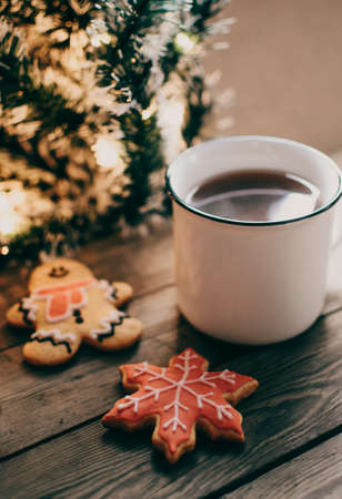 Christmas cookies. Flat lay winter cozy Christmas vintage background. The cup of tea or coffee. Christmas atmosphere.の写真素材