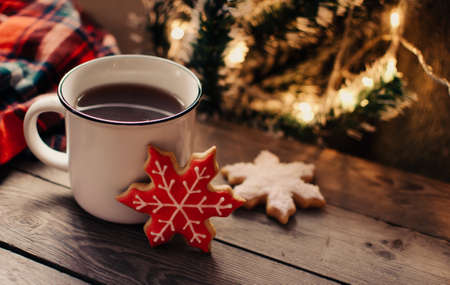 Christmas background with fir tree and decoration on dark wooden board. Christmas mood. Flat lay winter cozy vintage background.の写真素材