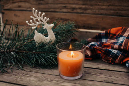 Flat lay winter cozy Christmas vintage background with copy space. Candle. Winter background. Christmas atmosphere. Christmas deer.の写真素材