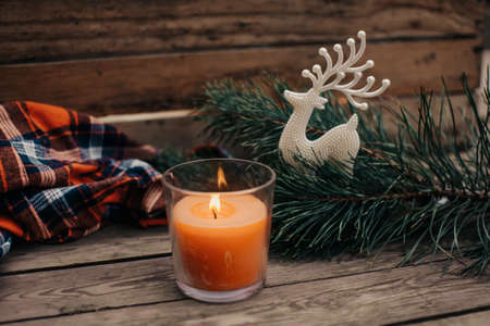 Flat lay winter cozy Christmas vintage background with copy space. Candle. Winter background. Christmas atmosphere. Christmas deer.の写真素材