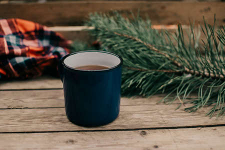 Flat lay winter and autumn cozy vintage background with copy space. The cup of tea or coffee on wooden table. Christmas atmosphere.の写真素材