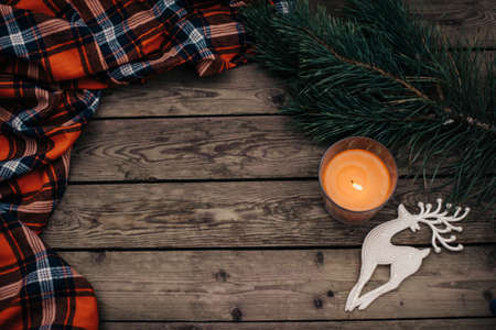 Flat lay winter cozy Christmas vintage background with copy space. Candle. Winter background. Christmas atmosphere. Christmas deer.の写真素材