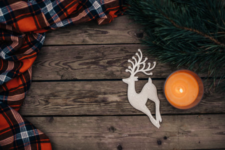 Flat lay winter cozy Christmas vintage background with copy space. Candle. Winter background. Christmas atmosphere. Christmas deer.の写真素材