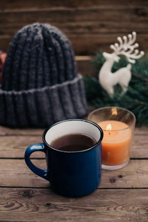 Flat lay winter and autumn cozy vintage background with copy space. The cup of tea or coffee on wooden table. Christmas atmosphere.の写真素材