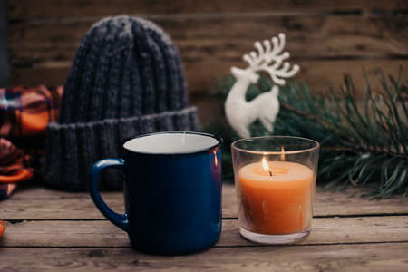 Flat lay winter and autumn cozy vintage background with copy space. The cup of tea or coffee on wooden table. Christmas atmosphere.の写真素材