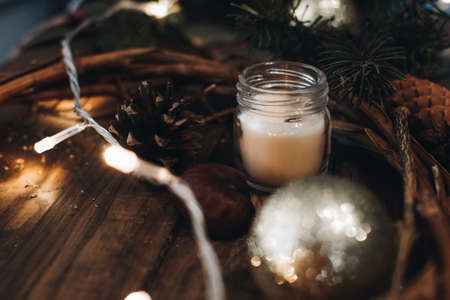Scandinavian hygge styled Christmas composition. Cozy winter homely scene with books, cup of tea or coffee, cookies, cinnamon sticks and knitted things. Santa Claus working place. Flatlay. Home decor.の写真素材