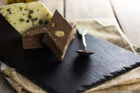 Halva made frome tahini paste sesame and pistachio nut, popular dessert of Middle East. Selective...