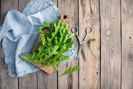 Green leaves of arugula on the napkin. Ingredients for the salad. Top viewの写真素材