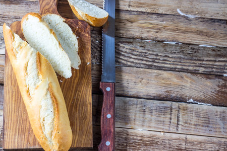 Crusty mini French baguettes on white background