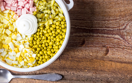 ingredients for Russian traditional salad Olivier with vegetables and meat. Winter salad. Top viewの写真素材