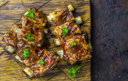 Smoked Roasted pork ribs over blackの写真素材