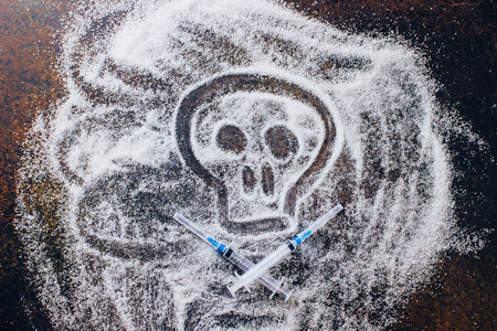 Unhealthy white sugar concept. The skull made of sugarの写真素材