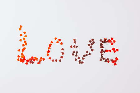 Valentines Day border of colorful paper hearts over whiteの写真素材