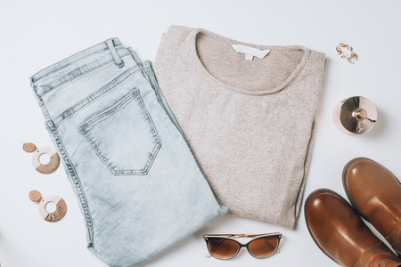 Woman autumn and winter clothes collage on white, flat lay, top viewの写真素材
