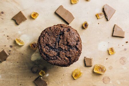 Homemade chocolate cookies with cracks. Natural handmade organic snakes for healthy breakfast. Beige stone background. Flat lay. Space for textの写真素材