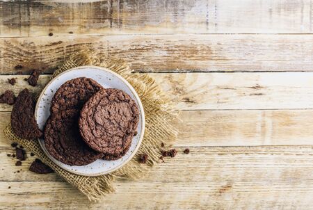 Double chocolate chip cookies on wooden background. Top viewの写真素材