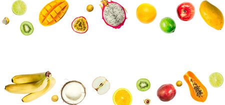 Creative layout made of passion fruit, pitahaya, mango, orange, papaya, coconut, longa, bananas, apples, kiwi, limeの写真素材