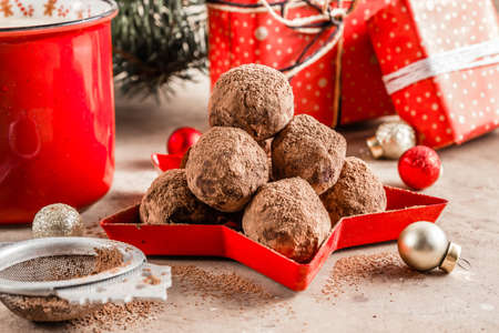 Homemade chocolate truffles candy ball on a christmas background. Selective focusの写真素材
