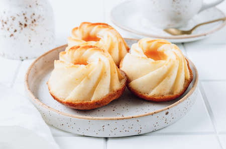 Cottage cheese cakes with mango sauce and latte on white background. selective focusの写真素材