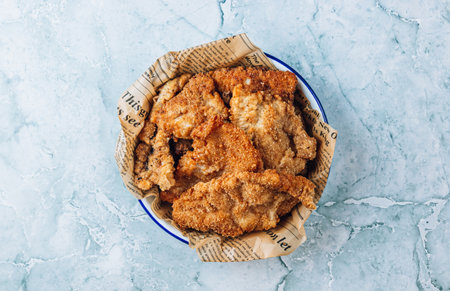 Breaded fried squid chops on gray marble background.の写真素材