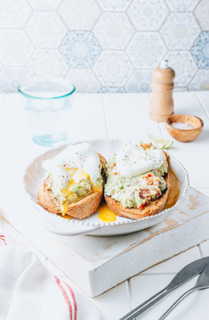 Avocado toast with poached egg. Healhty breakfast concept.の写真素材